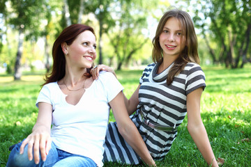 Naklejka premium Mother with her daughter in summer park