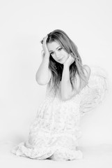 The young beautiful girl an angel with wings on a white backgrou