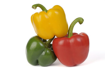 Fresh green red and yellow paprika isolated on white