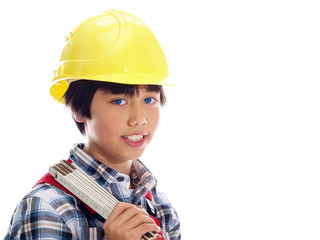 smiling boy wearing construction helmet