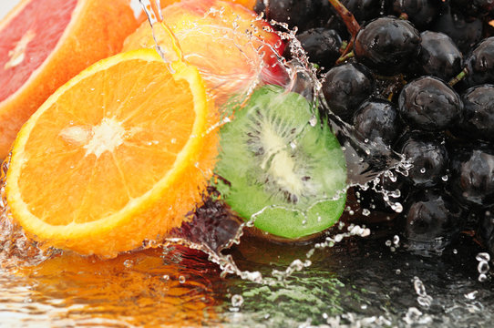 Pure fruit in a spray of water © Serghei V