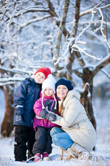Fototapeta na wymiar Family outdoors at winter