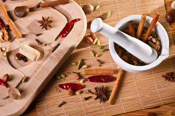 White mortar and different kinds of spices