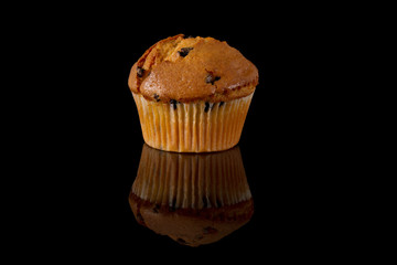 Chocolate Chip Muffin with Reflection on a Black Background