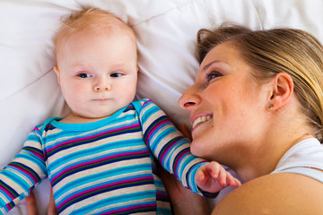 Mother with happy and cute infant baby girl