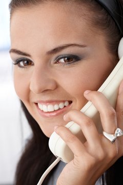 Closeup portrait of smiling woman on phone