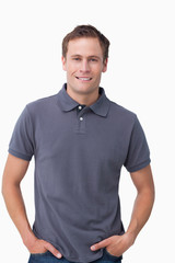 Obraz premium Smiling young male with hands in his pockets