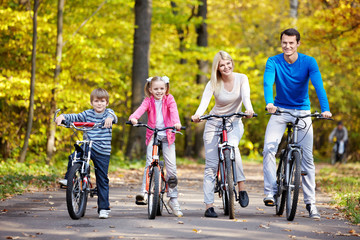 Families with children on bicycles