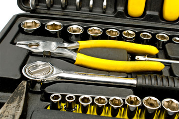 Set of various chrome yellow tools in box