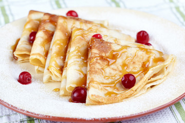 Pancakes with cranberry berries and honey