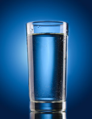 glass of water on blue background
