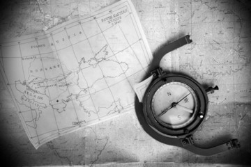 Fototapeta na wymiar black and white maps and compass