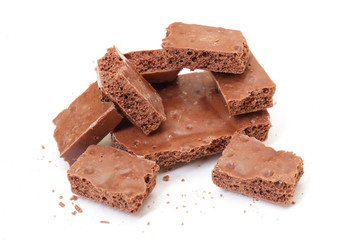 chocolate pieces on white background