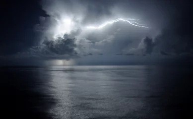 Peel and stick wall murals Storm Lightning in a cloud over ocean