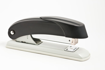 Black professional stapler isolated on white background