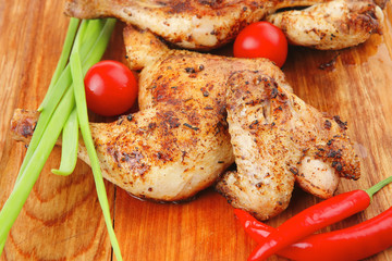 grilled meat : chicken quarters garnished with green sprouts