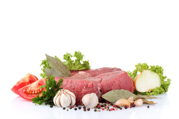 raw  meat, vegetables and spices isolated on white