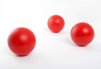 Red balls on white background