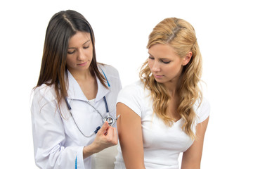 Doctor making insulin or flu vaccination shot by syringe