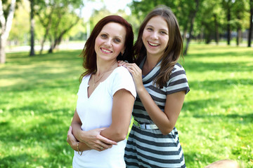 Fototapeta premium Mother with her daughter in summer park