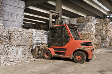 Recycling of waste paper with fork lift