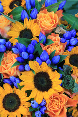 Sunflower arrangement in blue and yellow