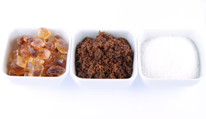 Sugar: brown, white and brown rock candy in bowls