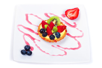 Delicious custard tart with blueberries, kiwi and strawberries