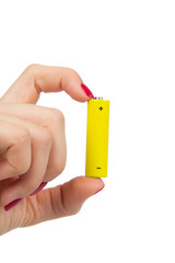 Woman hand hold yellow AA battery in hand