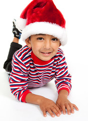 Portrait of a Smiling Child Wearing Santa Hat on White