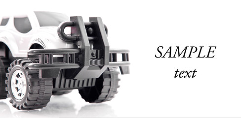 Quarter Front Angle of an Off Road Toy Truck with Space for Text