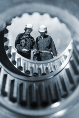 industry workers inside machinery