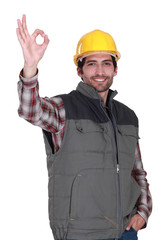 portrait of foreman making okay sign