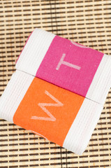 Two kitchen towels with the letters