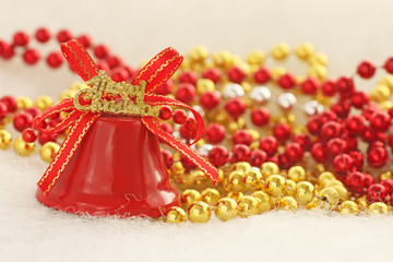 Fototapeta na wymiar merry christmas bell near beads