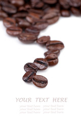 Intensely dark coffee beans.  Copy space for your text