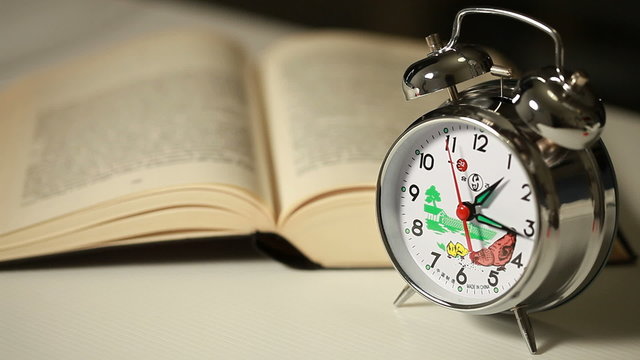 Alarm clock with book