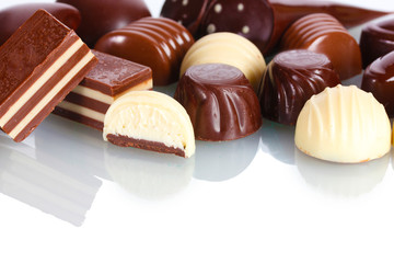 Many different chocolate candy isolated on white
