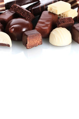 Many different chocolate candy isolated on white