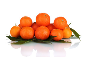 Ripe tasty tangerines with leaves isolated on white