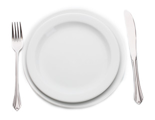 White empty plate with fork and knife isolated on white