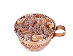 Brown sugar in a cup isolated white background