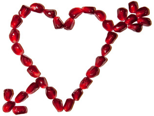 Love symbol pierced with arrow made of pomegranate seeds