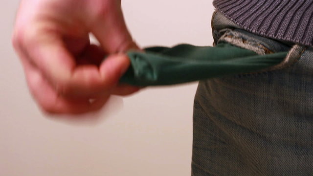 Man showing his empty pocket