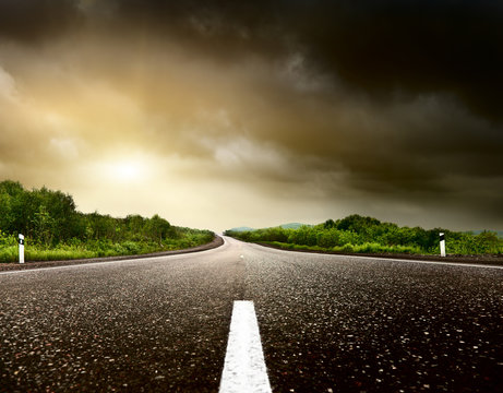 Stormy Sky And Road In Forest