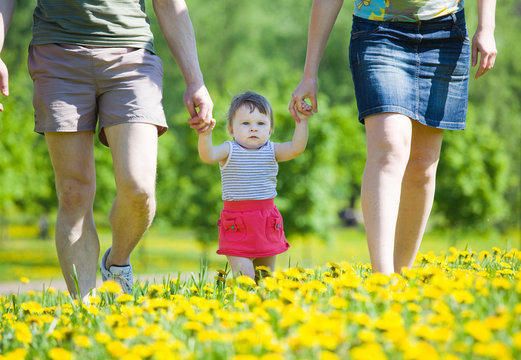 Family on walk in park.