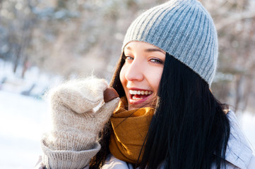 Portrait of young beautiful girl having fun outdoors in winter f