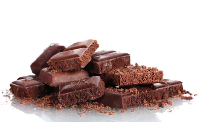 Slices of milk and dark chocolate bar with chocolate shavings