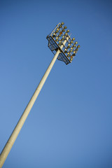 spotlight pole, High spotlight pole in clear blue sky.