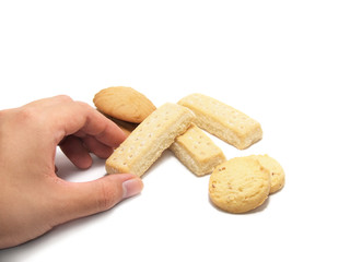 a hand about to get some  cookies isolated on a white background